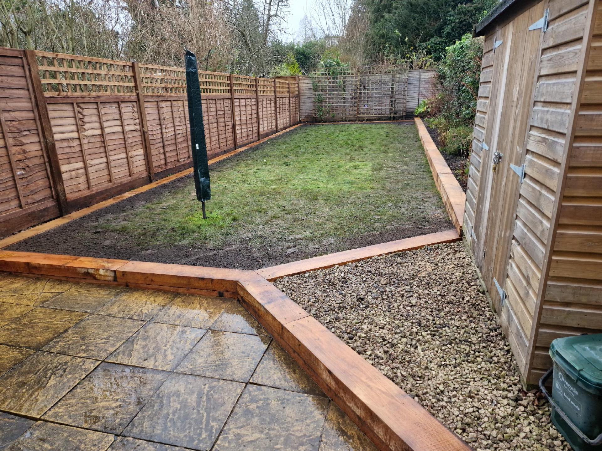 New fencing and sleepers edging patio and lawn area.
