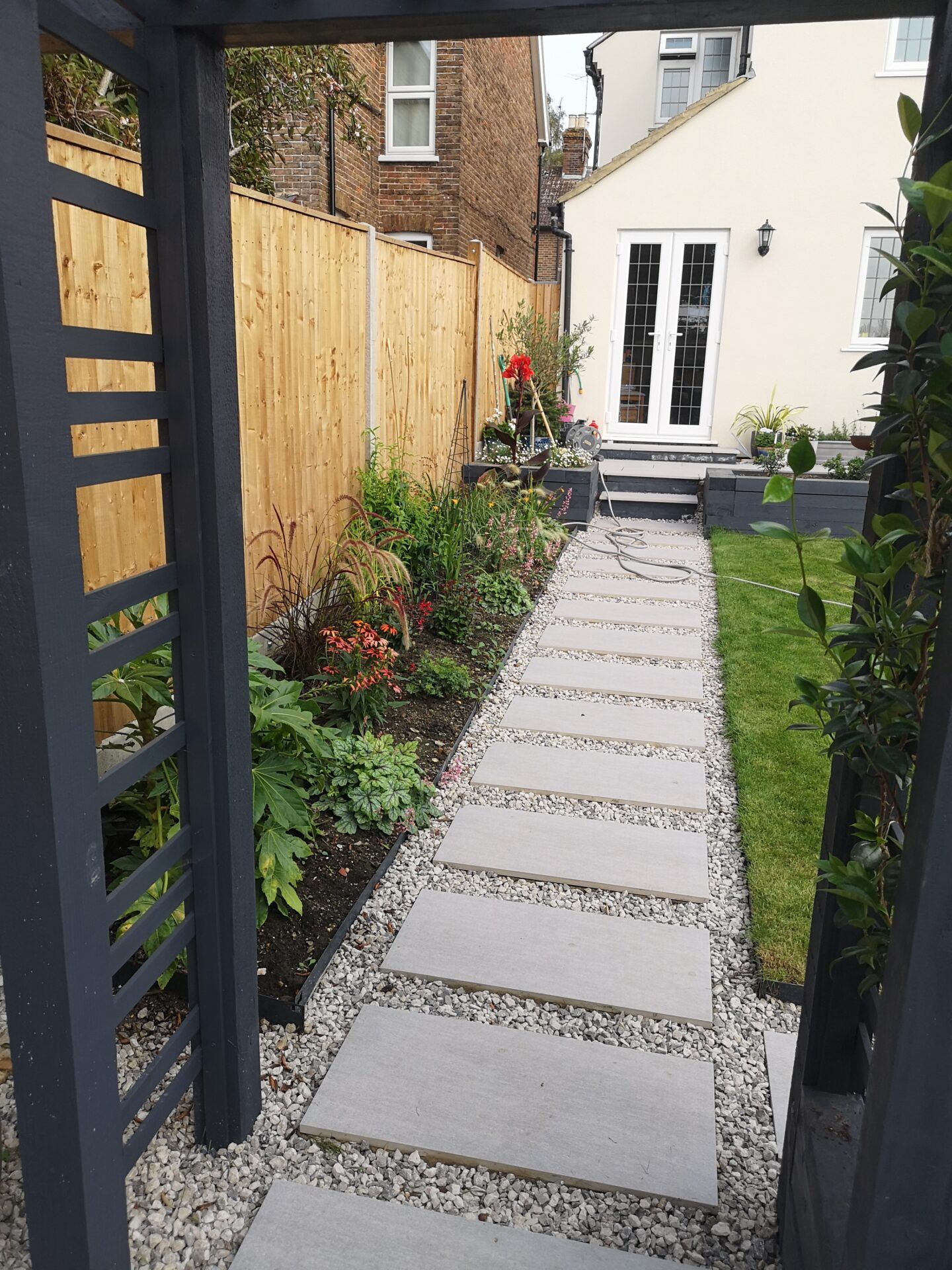 garden path made from slabs and chippings leading back to property
