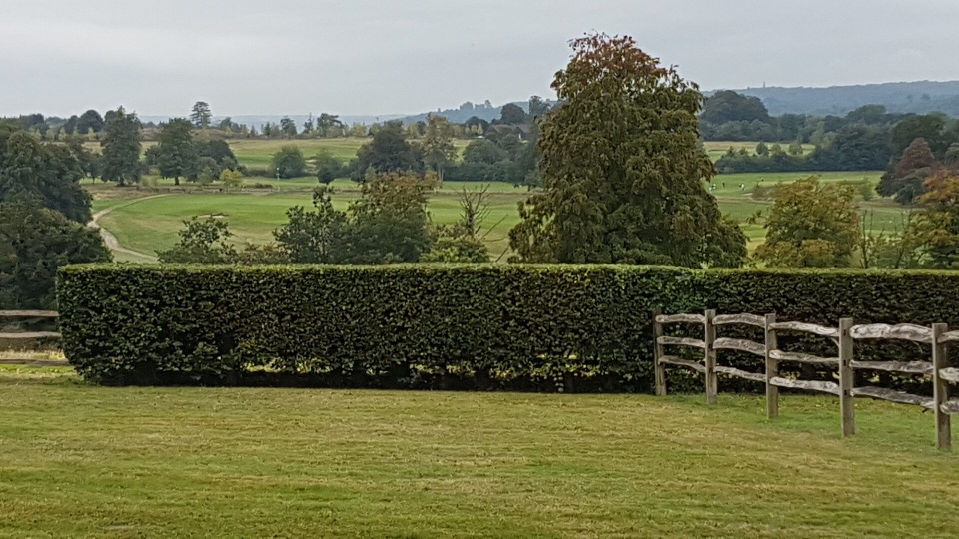 view of large head at bottom of garden looking out over open countryside.